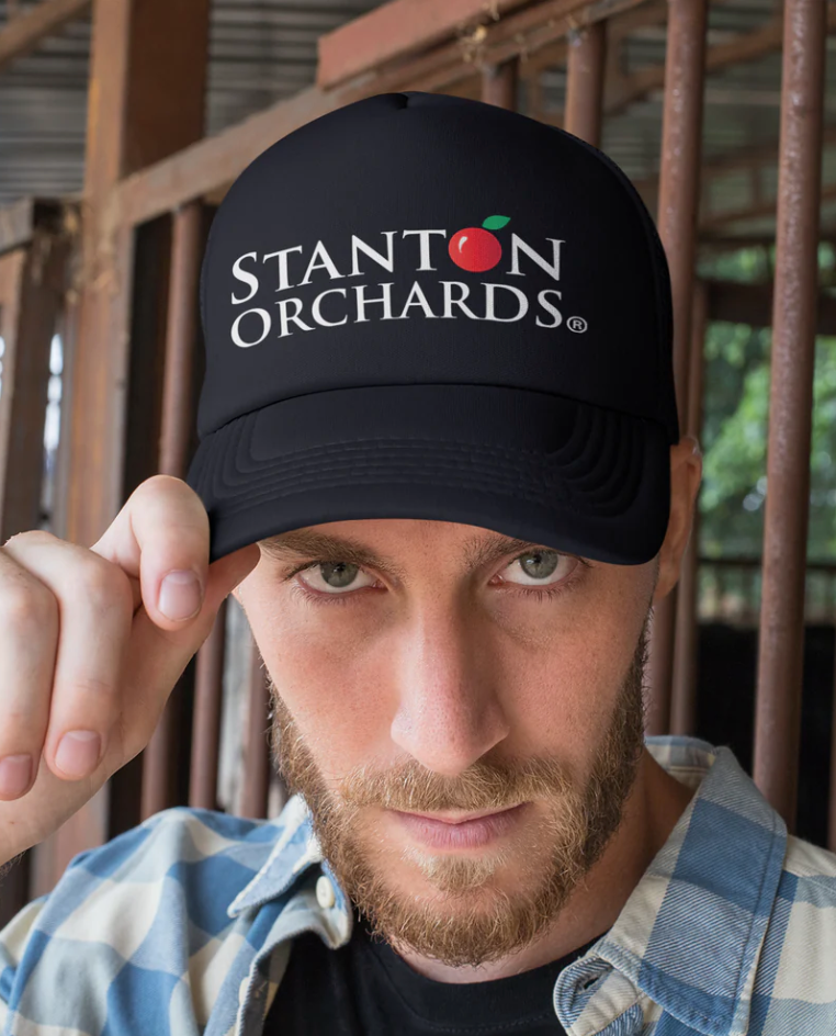 Trendy Trucker Cap w/ Stanton Orchards Logo. Be a fan!